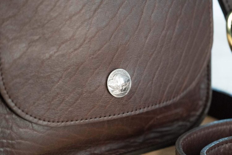 Genuine Buffalo Nickel on front flap of the purse