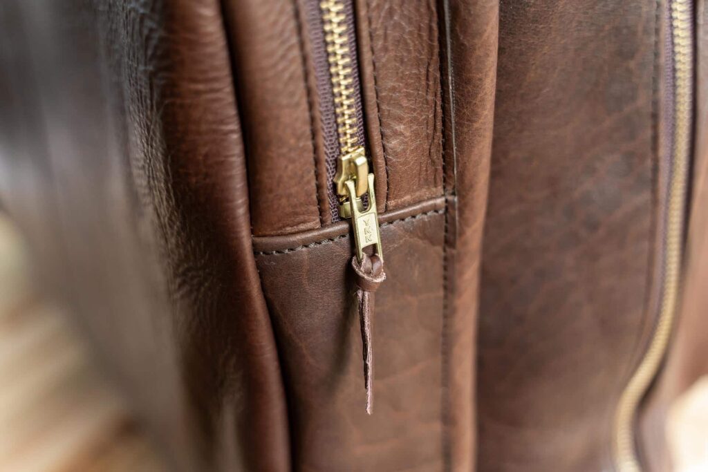 Leather Pull on Brass Zipper to open Flight Bag Pockets