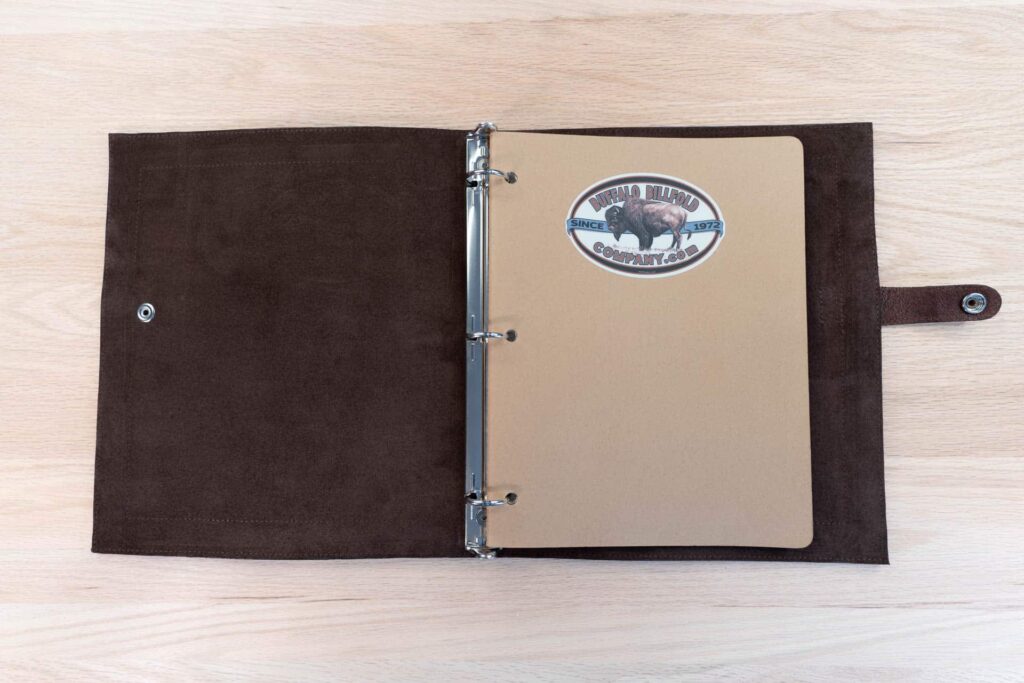 Notebook inside the 3 ring binder with Buffalo Billfold Company sticker.