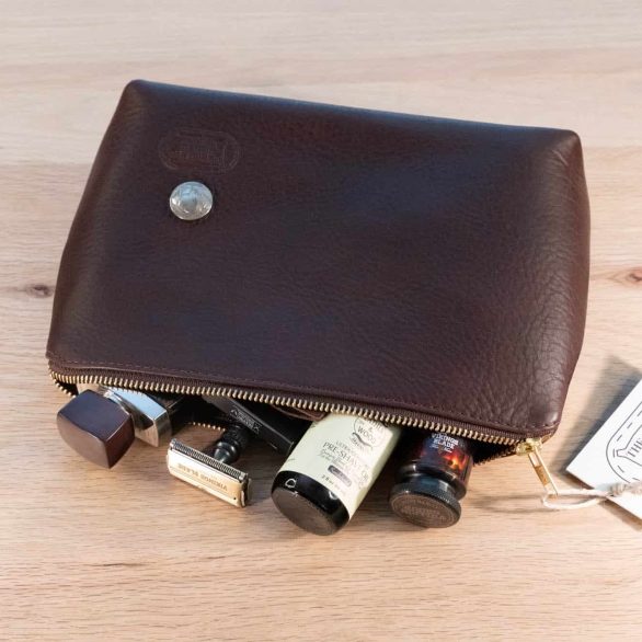 Leather Dopp Kit holding mens shaving kit.