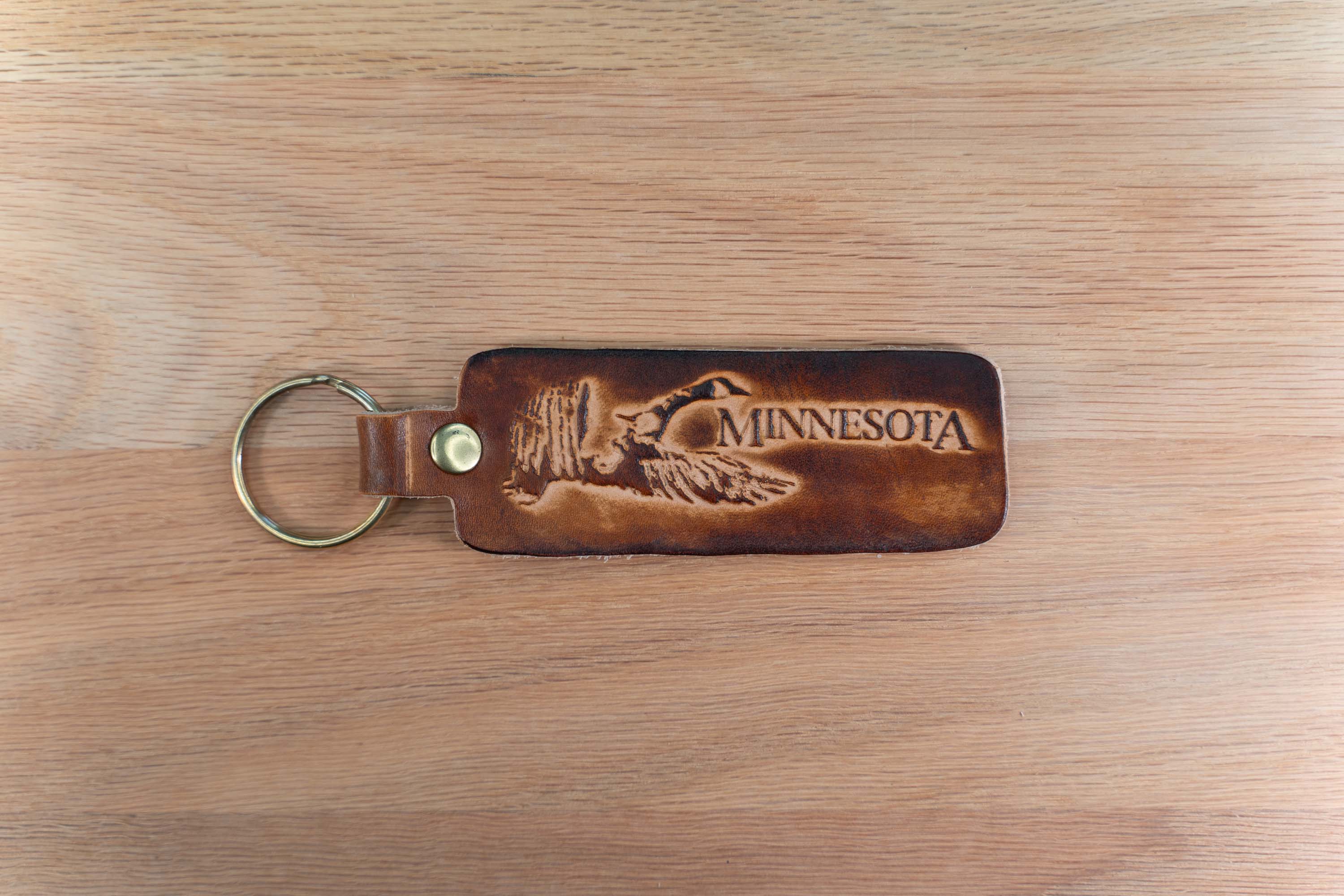 Minnesota Keychain - Flying Goose Design - Brown Sunburst Minnesota Keychain - Flying Goose Design - Brown Sunburst