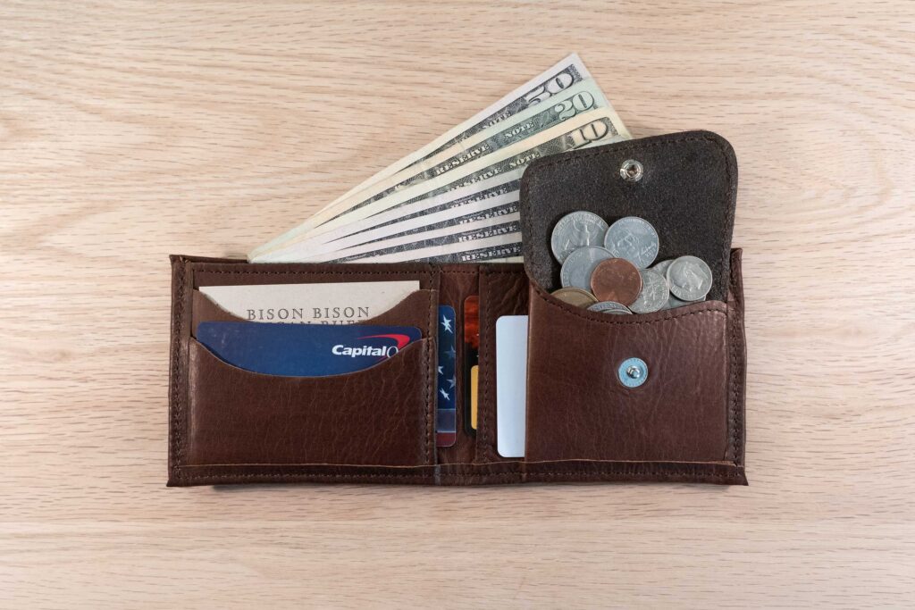 Mens Leather Bifold Wallet with Coin Pocket holding coins Mens Leather Bifold Wallet with Coin Pocket holding coins