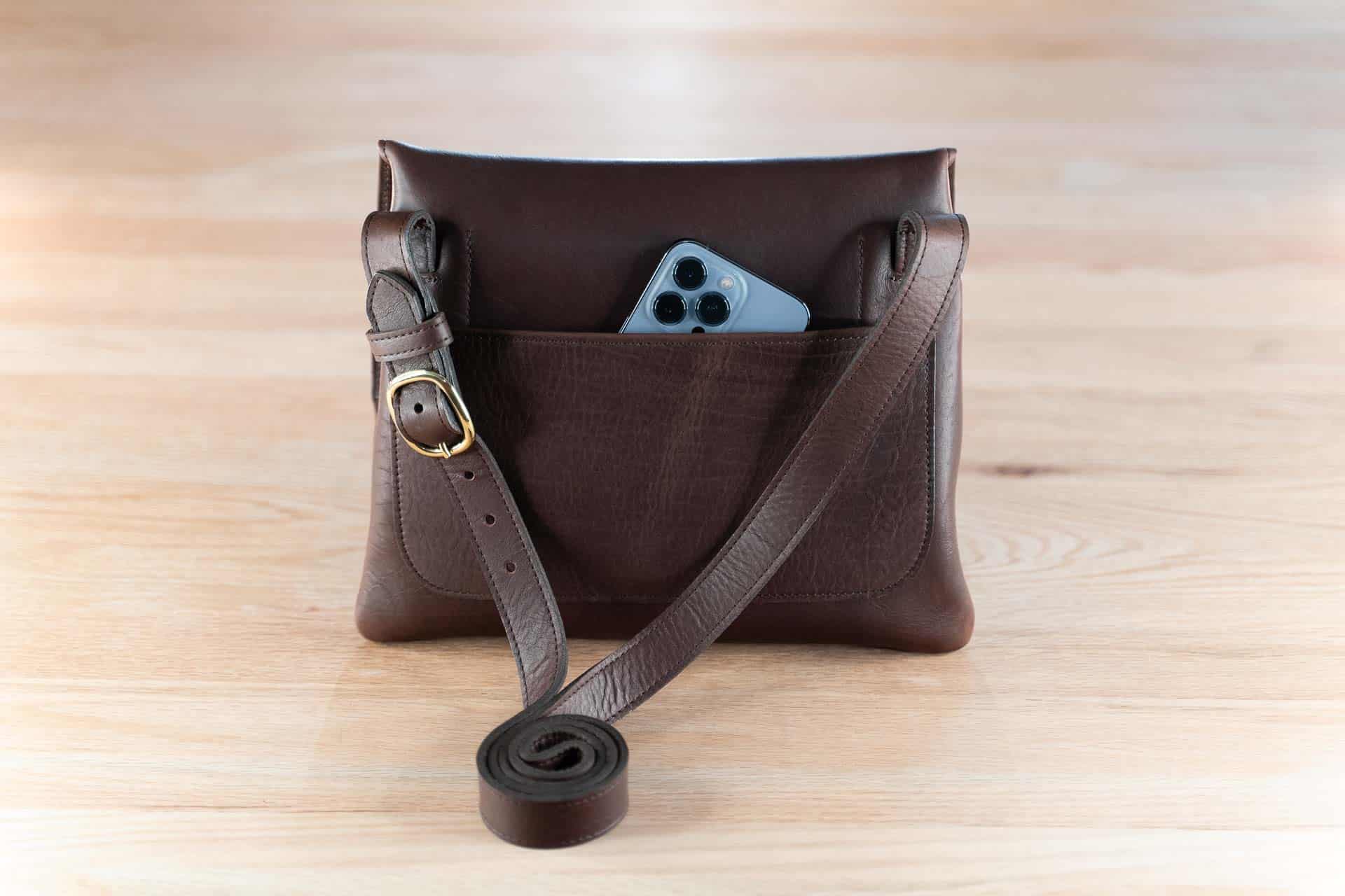 https://buffalobillfoldcompany.com/wp-content/uploads/2019/01/Brown-Handmade-Leather-Purse-Phone-Pocket.jpg