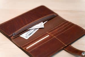 Two bill slots separated by a leather divider