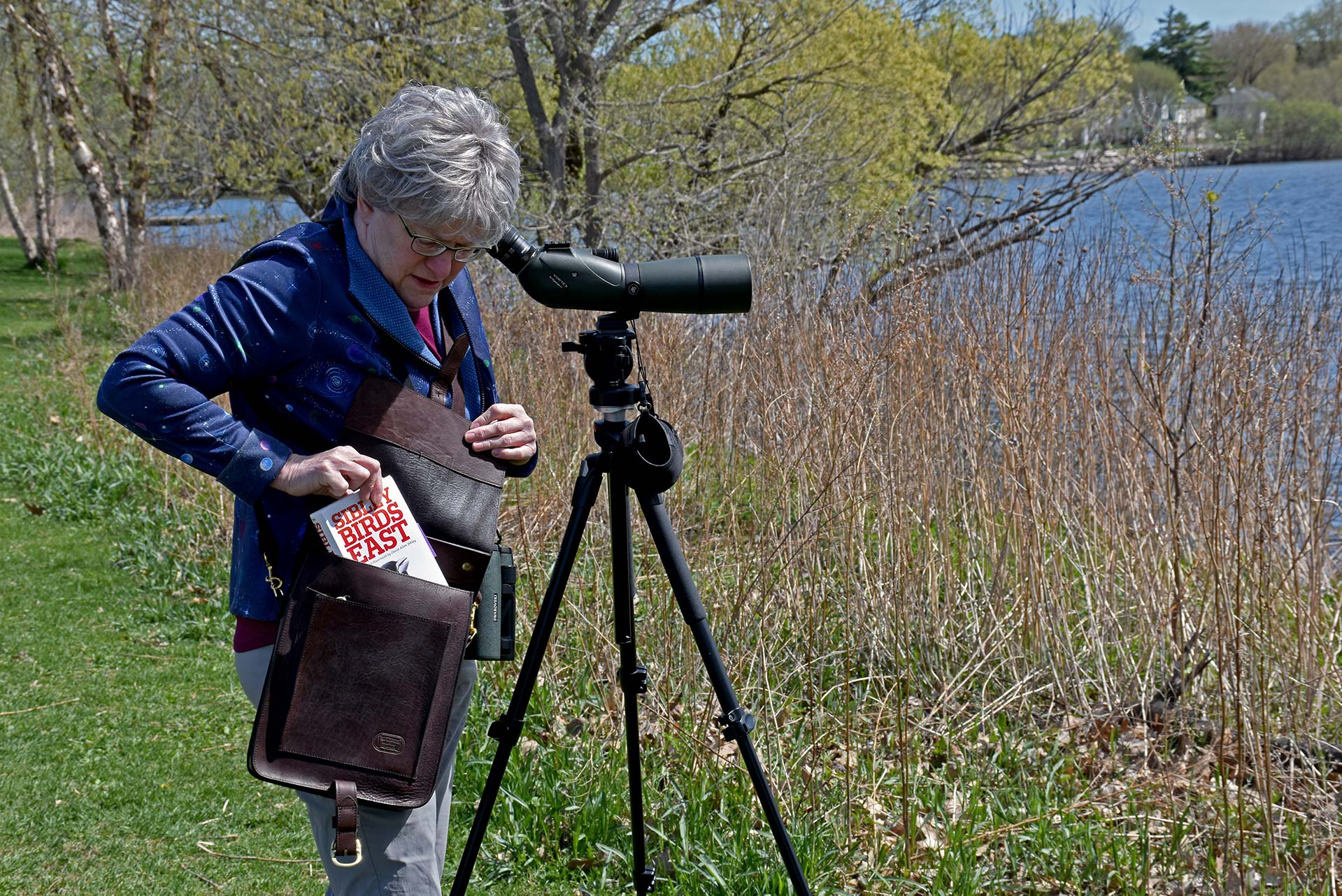 Naturalist using expedition bag for birding