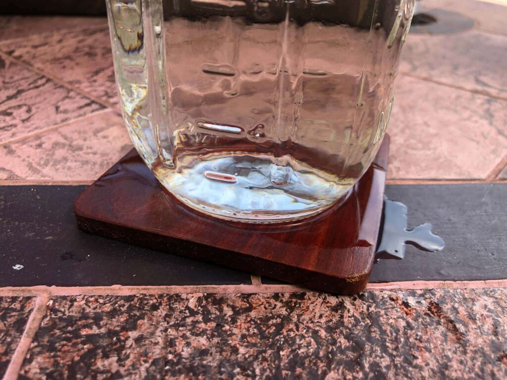 Non absorbent coaster spilling onto furniture