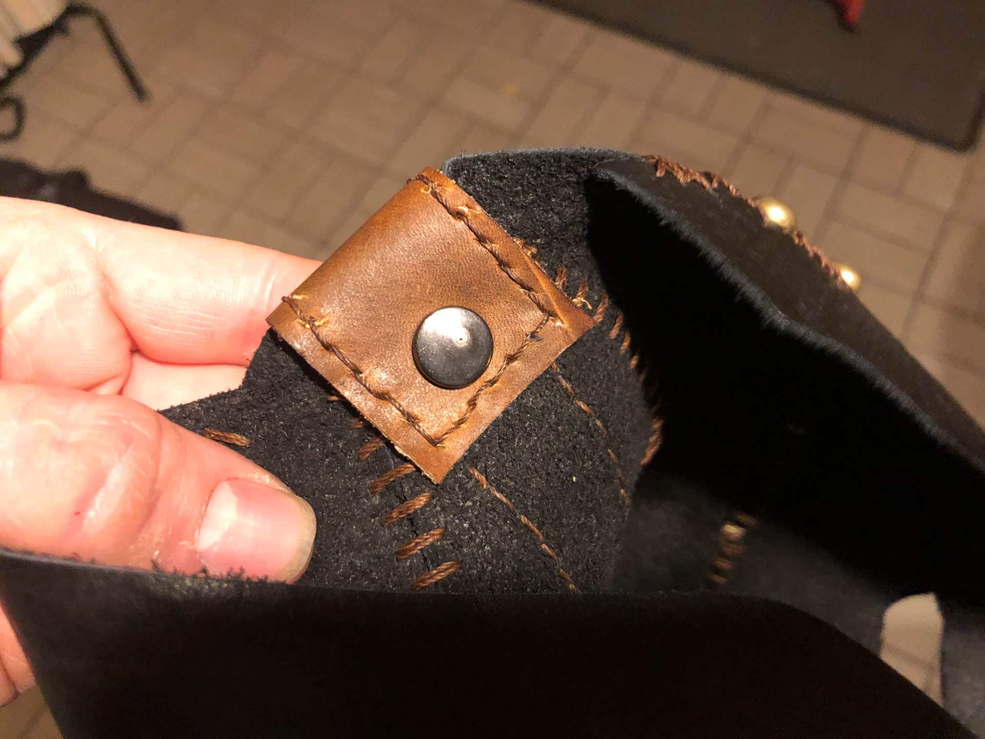 Snap to hold leather top brace in place