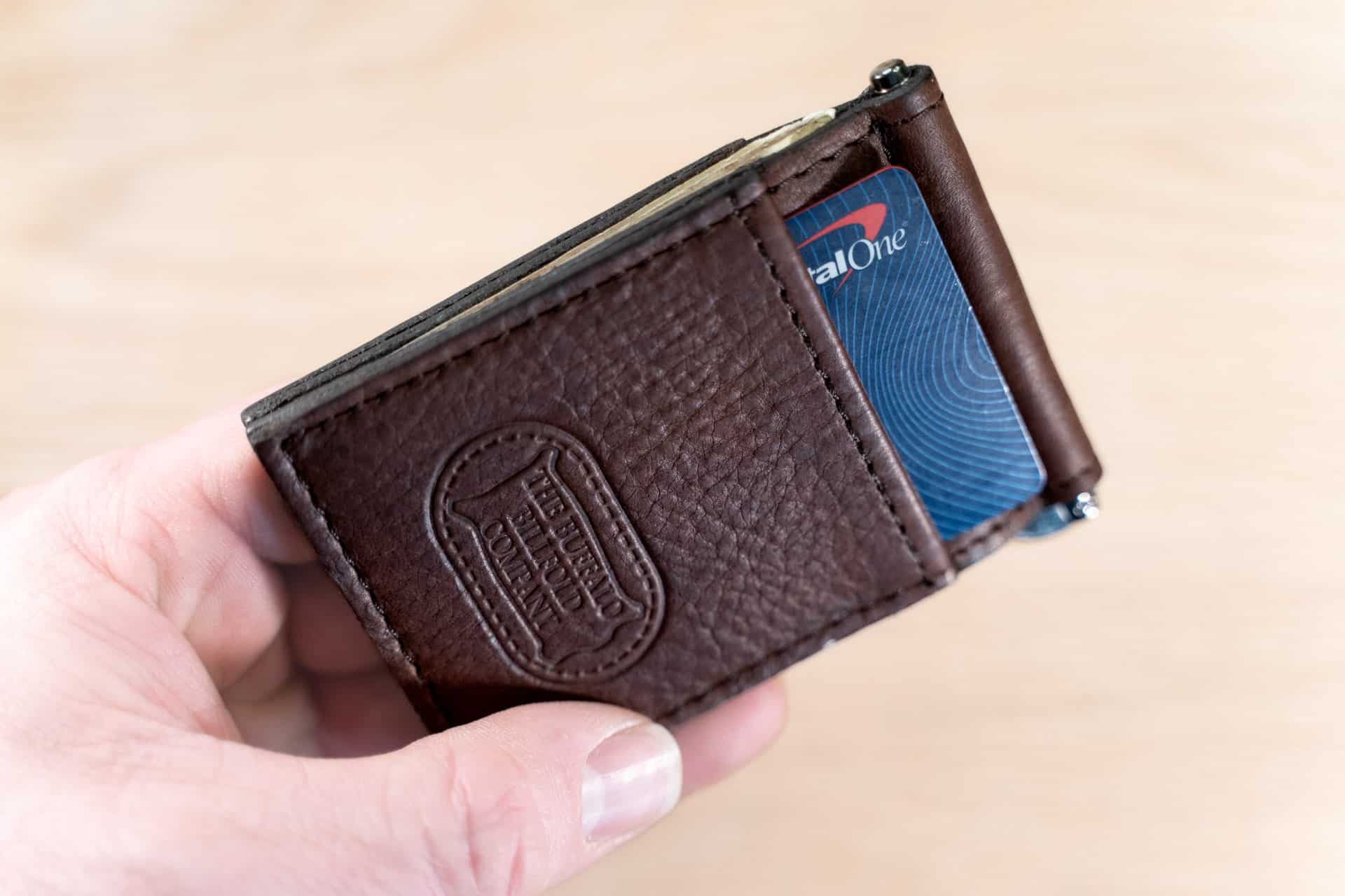 Credit card inserted in money clip card holder