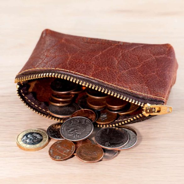 Coins inside this red leather coin case with zipper