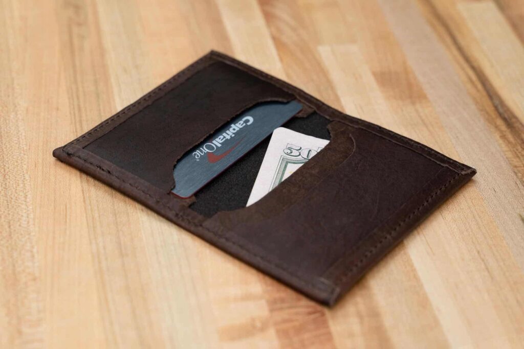 This compact promotional leather card case holds credit cards and bills.