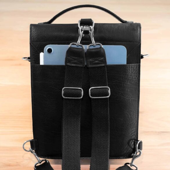 Back of the black leather backpack with iPad in exterior pocket