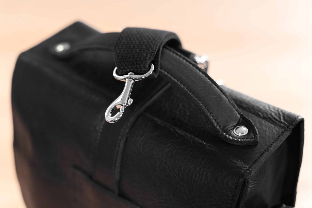 Detachable Strap With Nickel Plated Brass Clip On Black Backpack.