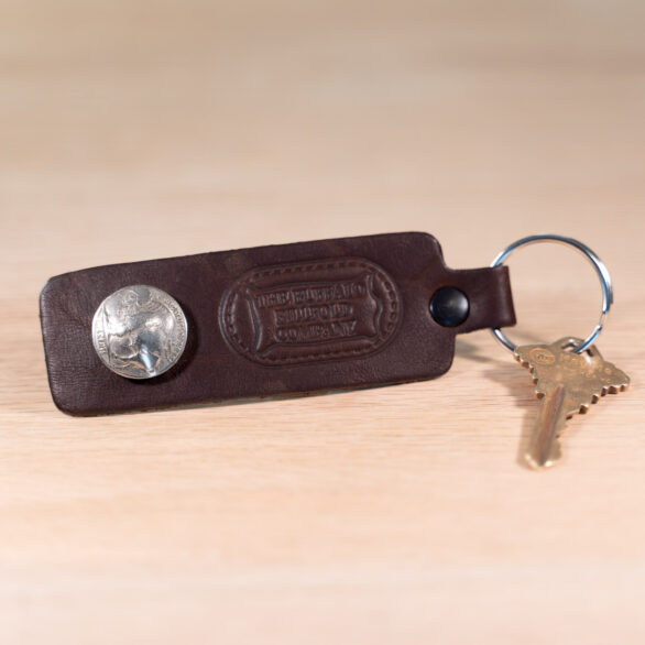 Brown Leather Keychain with Buffalo Nickel - Holding a Key
