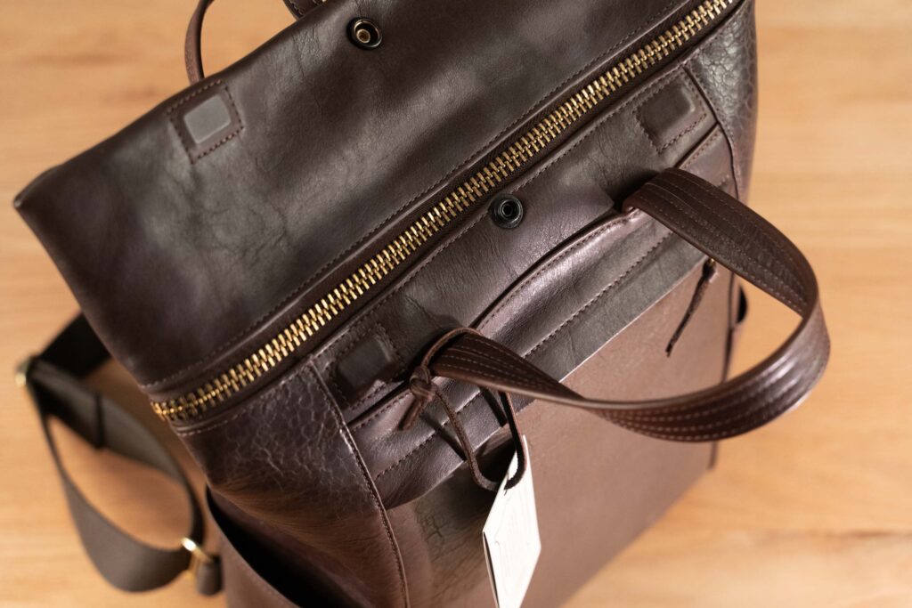 Northbound Backpack Magnetic Closures Magnetic Closure Detail On Northbound Bison Leather Backpack