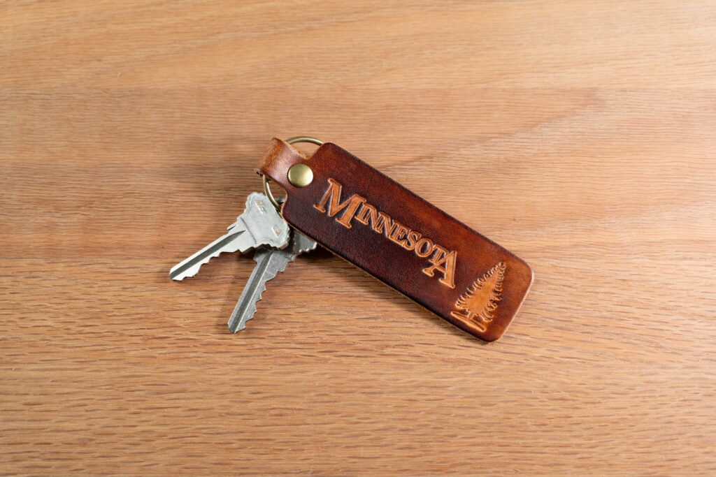 Leather Keychain - The Norway Pine - Minnesota Leather Keychain Showcasing Minnesota And The Norway Pine